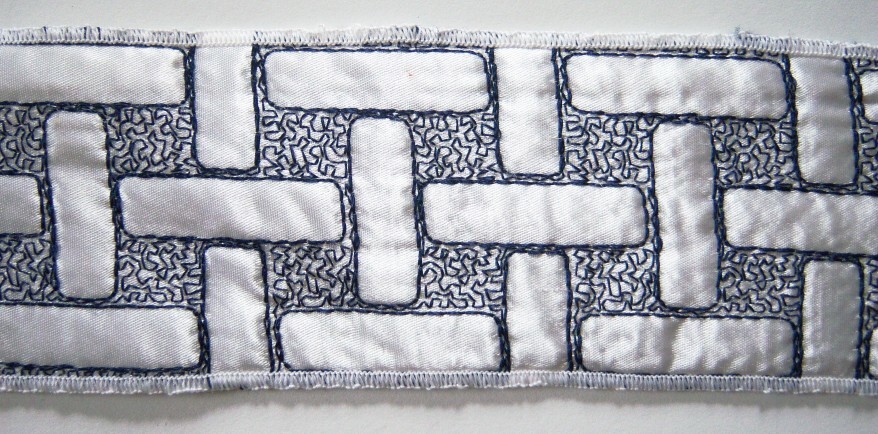 White Satin"Navy Embroidered Quilted